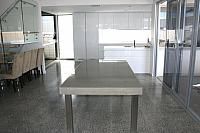 concrete and stainless steel dining table